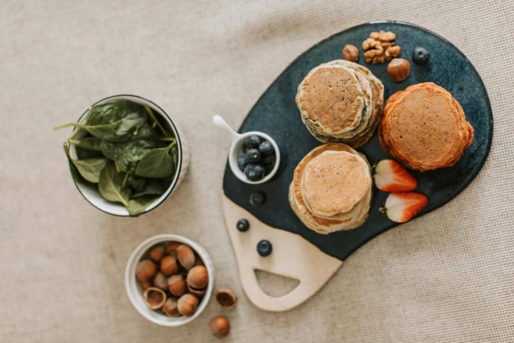 banana spinach pancakes on a board