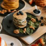 banana spinach pancakes on a food board