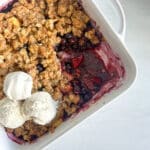 apple & blueberry crumble with ice cream on top